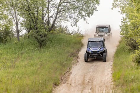 UTV rental riders coming down a hill.